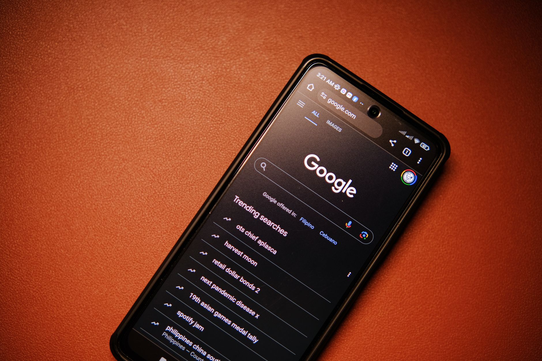 an older adult typing a Google account password on a smartphone screen