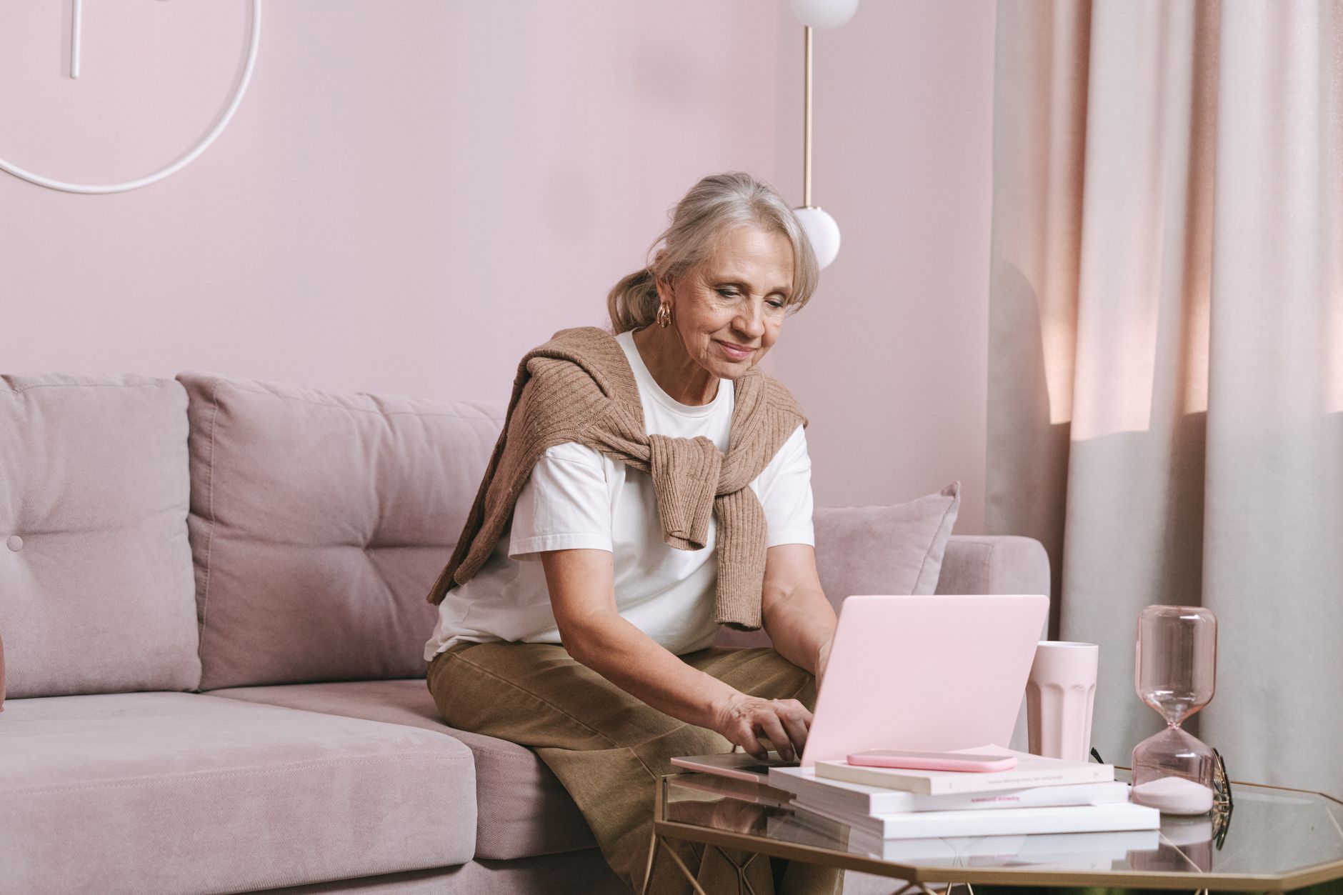 a senior woman reviewing email provider options on a laptop screen